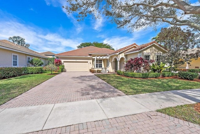 mediterranean / spanish-style home featuring a garage and a front lawn