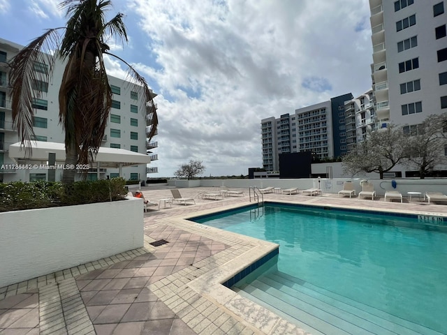 view of swimming pool with a patio area