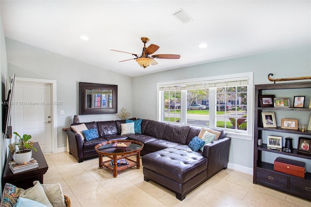 living room with vaulted ceiling, ceiling fan, and light tile patterned flooring