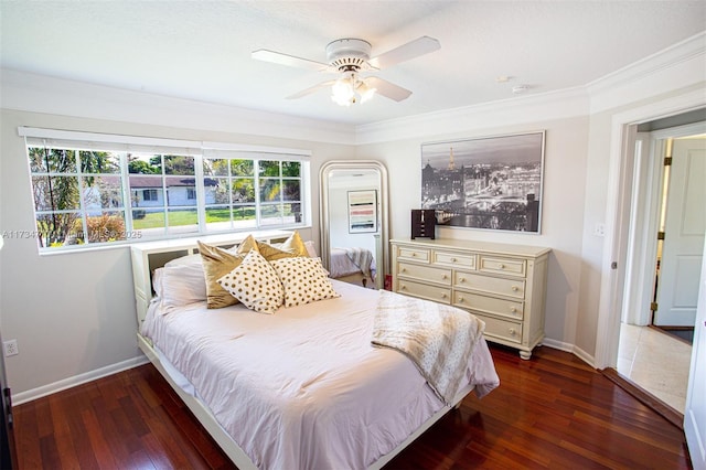 bedroom with ornamental molding, dark hardwood / wood-style floors, and ceiling fan