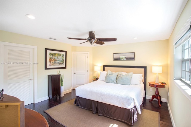 bedroom featuring dark hardwood / wood-style flooring and ceiling fan