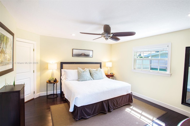 bedroom featuring dark wood-type flooring and ceiling fan