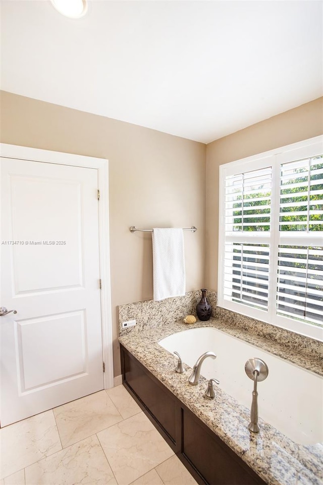 bathroom featuring a tub