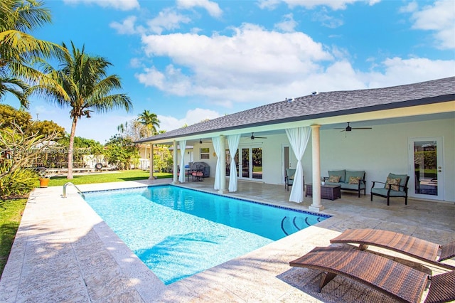 view of swimming pool featuring an outdoor living space, a patio, and ceiling fan