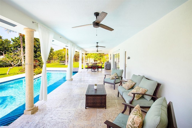 view of pool featuring an outdoor living space, a patio, and ceiling fan