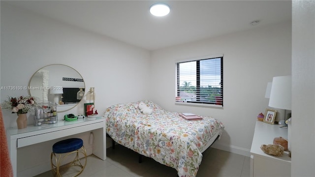 bedroom with light tile patterned flooring