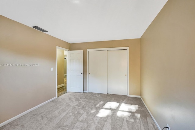 unfurnished bedroom featuring a closet and carpet