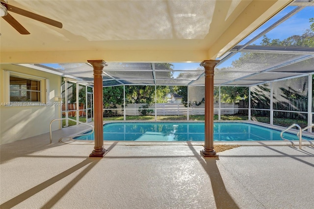 view of swimming pool with a lanai, a patio area, and ceiling fan