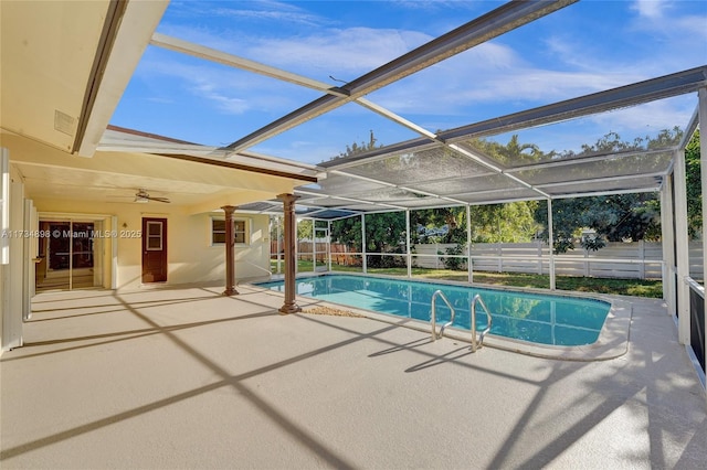 view of pool featuring a patio, a lanai, and ceiling fan