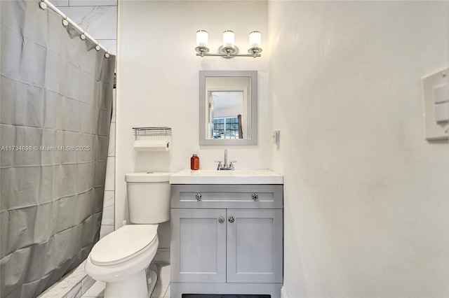 bathroom featuring vanity, toilet, and walk in shower