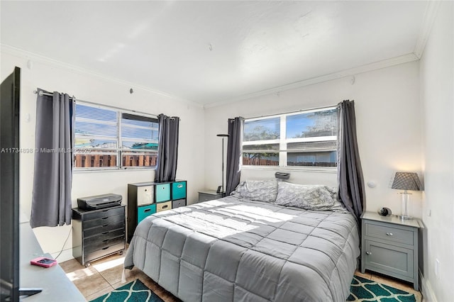 tiled bedroom featuring ornamental molding