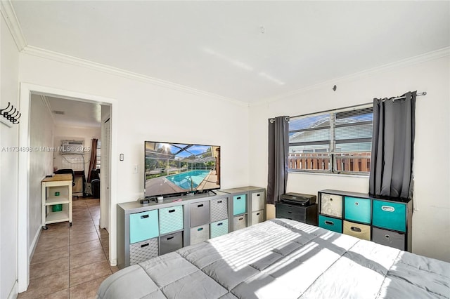 bedroom with crown molding and light tile patterned floors