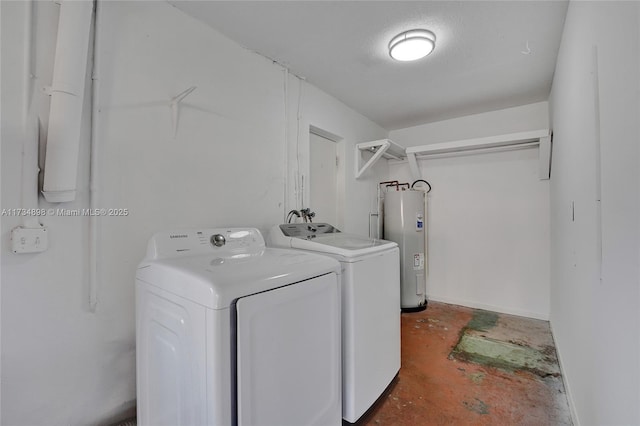 washroom with separate washer and dryer, electric water heater, and a textured ceiling