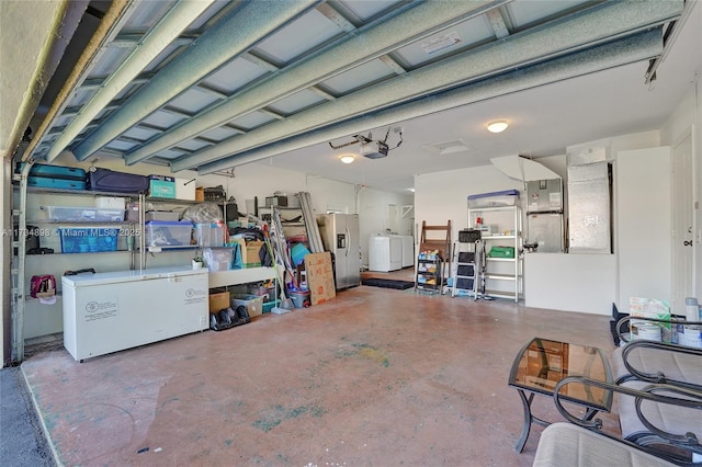 garage featuring stainless steel refrigerator with ice dispenser, a garage door opener, washer / clothes dryer, and heating unit