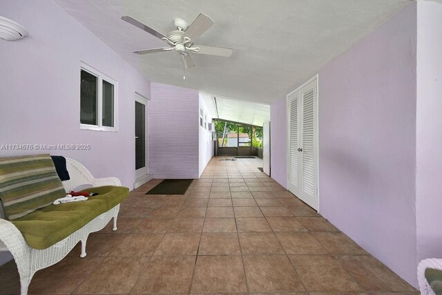 hallway featuring tile patterned flooring