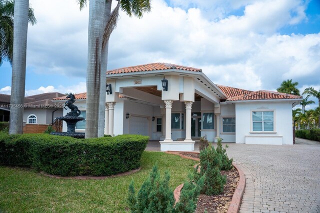 mediterranean / spanish house featuring a garage