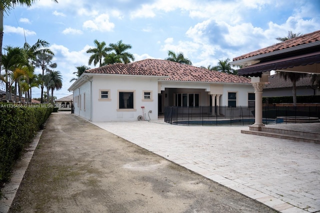 rear view of property with a patio area