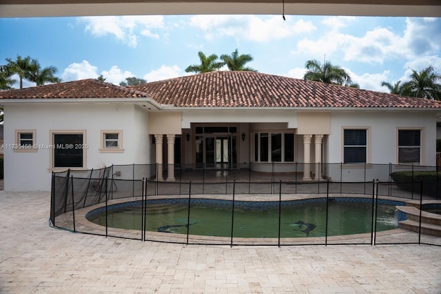 view of pool with a jacuzzi and a patio