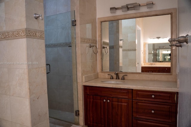 bathroom with an enclosed shower and vanity