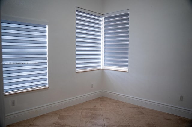 spare room with light tile patterned floors