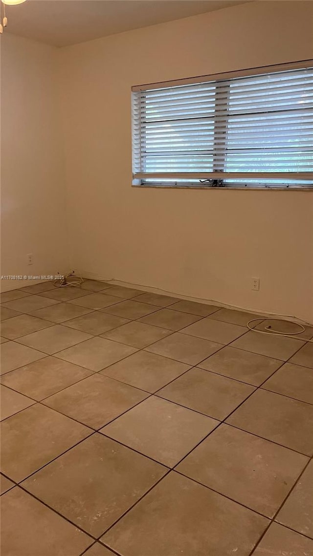 view of tiled spare room