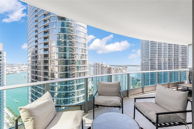 balcony featuring a water view