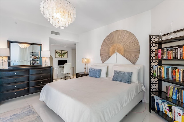 bedroom with a chandelier and light tile patterned flooring