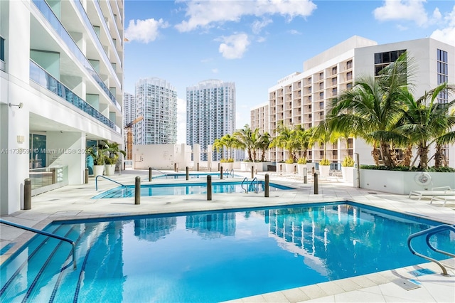 view of swimming pool featuring a patio