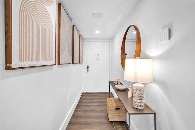 entryway with dark wood-type flooring