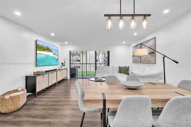 dining space with dark hardwood / wood-style flooring