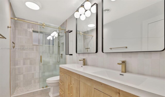 bathroom with walk in shower, vanity, toilet, and decorative backsplash