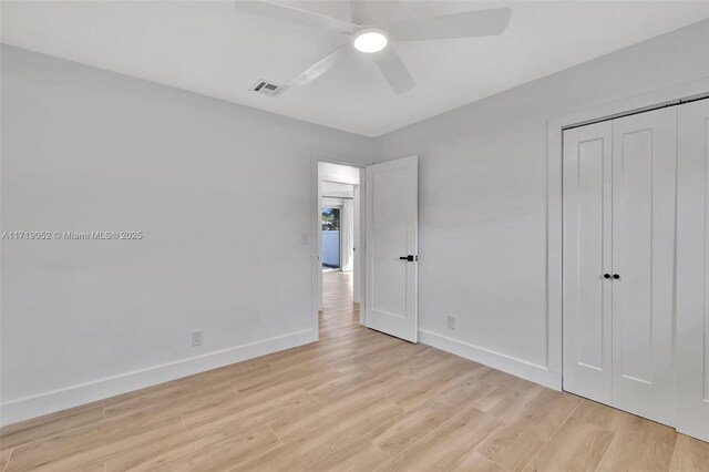 unfurnished bedroom with a closet, ceiling fan, and light hardwood / wood-style flooring