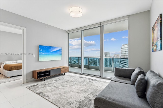 living room featuring floor to ceiling windows and light tile patterned floors