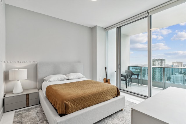 bedroom featuring access to exterior and expansive windows