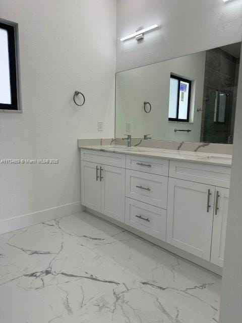 bathroom with vanity and an enclosed shower