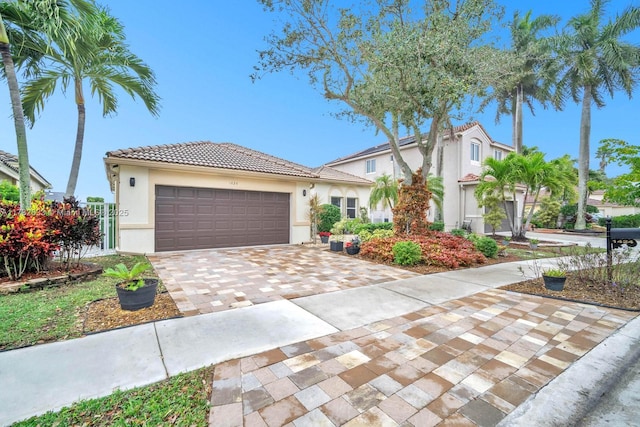 mediterranean / spanish-style home featuring a garage