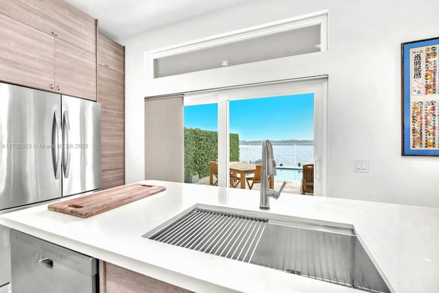 kitchen featuring stainless steel appliances and sink