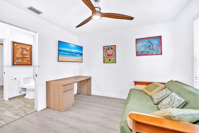 sitting room featuring light hardwood / wood-style floors and ceiling fan