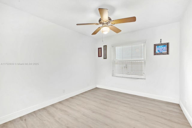 spare room with ceiling fan and light hardwood / wood-style flooring