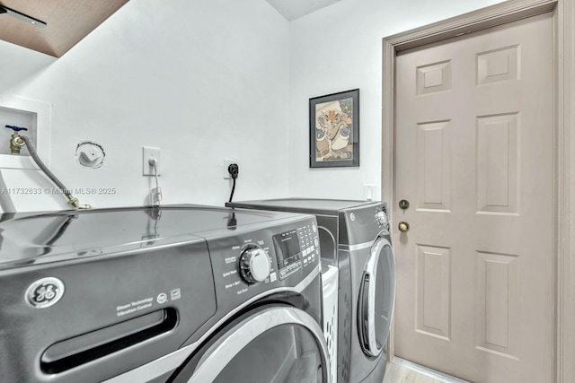 laundry room featuring separate washer and dryer