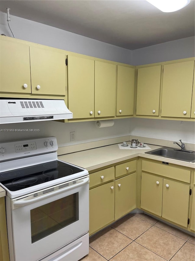 kitchen with light tile patterned flooring, white range with electric cooktop, ventilation hood, and sink