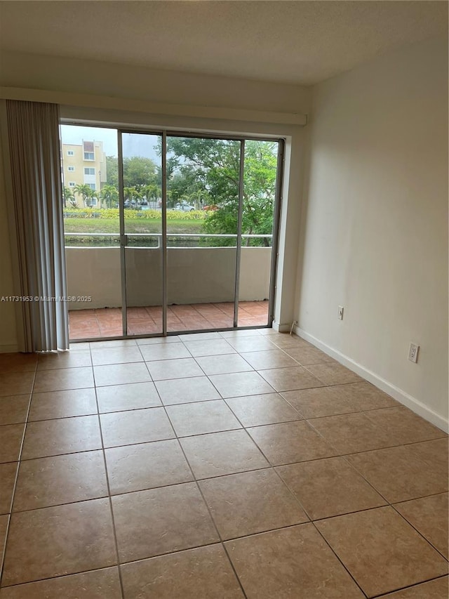 empty room featuring light tile patterned floors