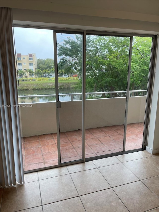 interior space with plenty of natural light and a water view