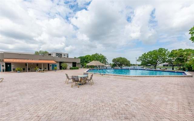 view of swimming pool with a patio