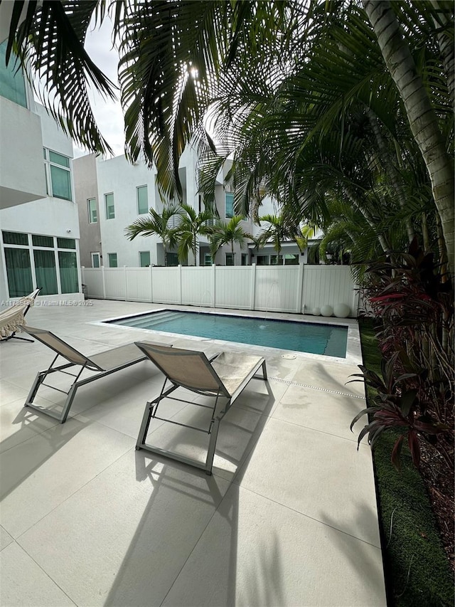 view of swimming pool featuring a patio area