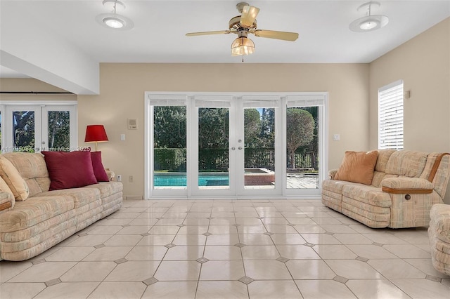 living room with french doors and ceiling fan