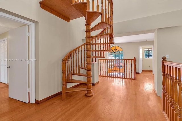 stairs with hardwood / wood-style floors