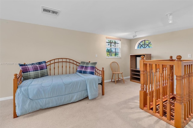 bedroom featuring carpet