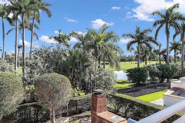 exterior space featuring a water view and a yard