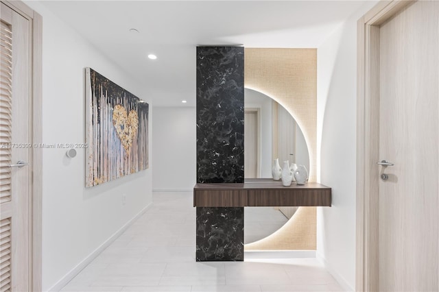 corridor with light tile patterned flooring